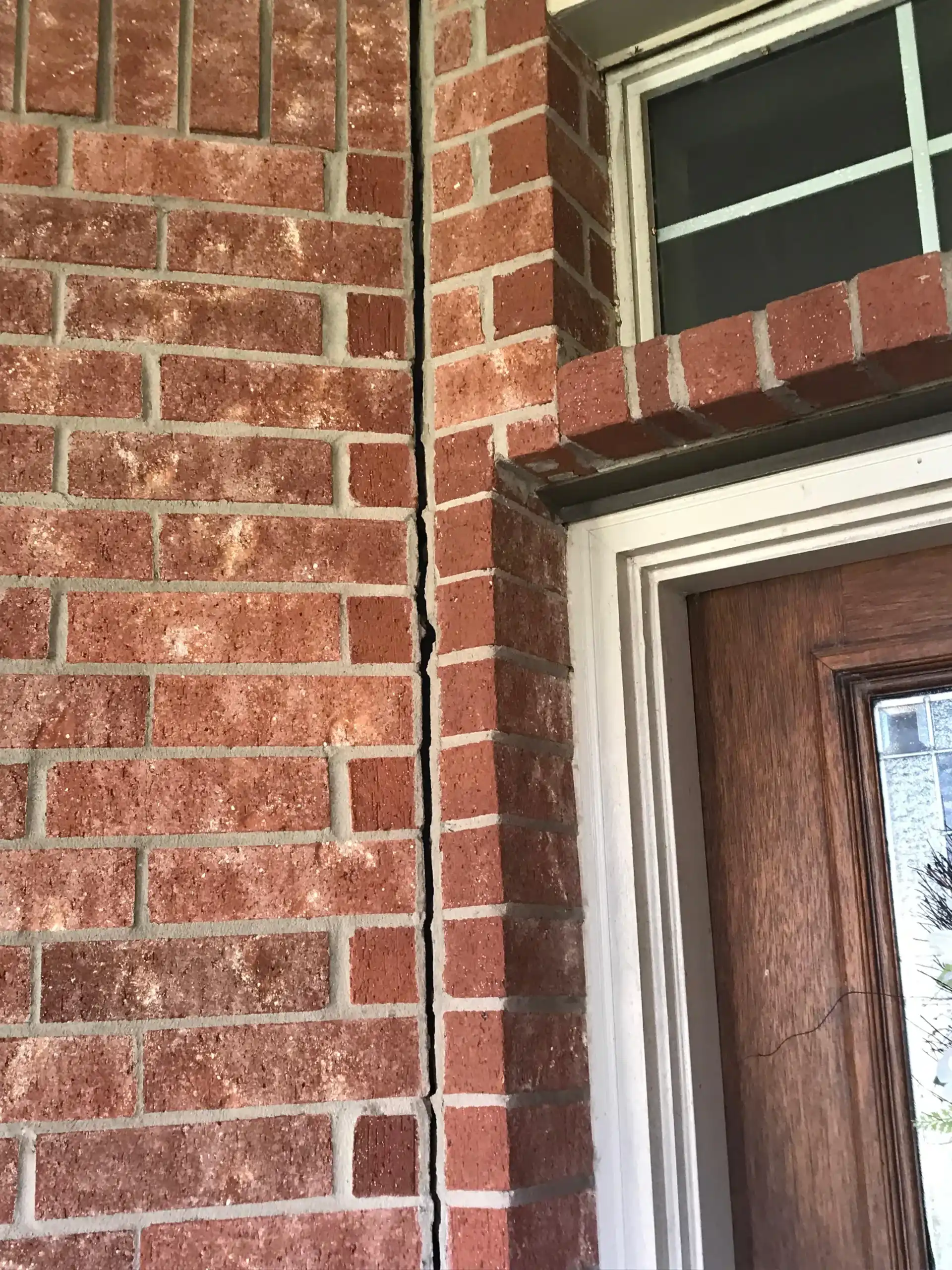 Foundation movement crack in the brick exterior of a Houston home inspected by FNF Foundation Repair